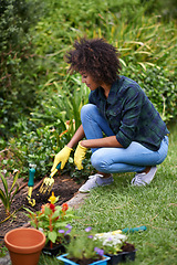 Image showing Woman, gardening and fork for soil, plants and happy for spring, outdoor and sustainability. Girl, African person and smile on ground for growth, development and nature with ecology in backyard