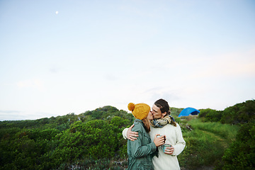 Image showing Camping, nature and couple with love, kiss and smile with happiness and holiday for honeymoon. Romance, travel or man with woman or embrace with vacation or bonding together with adventure or journey