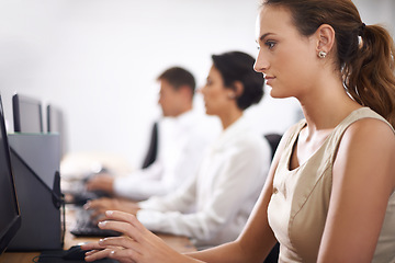 Image showing Business woman, computer and typing with team in call center for email, support or online service at office. Female person, consultant or employee working on desktop PC with group or agency for help