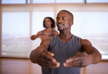 Image showing Gym, dance and man teaching people in studio for fitness, sport and exercise for balance with performance. Lesson, coach and male person training student in class, active and wellness with health
