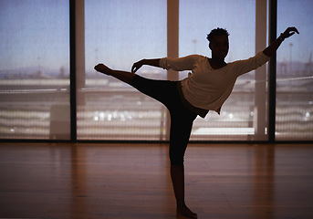 Image showing Woman, dancer and stretching with body for fitness, workout or indoor exercise at studio. Female person or ballet in practice, training or balance with foot on floor for graceful dancing or wellness