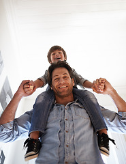 Image showing Piggyback, portrait or father with child in home, house or apartment for support, care or love. Happy, low angle or dad with kid to enjoy family vacation, holiday or holding hands together in England