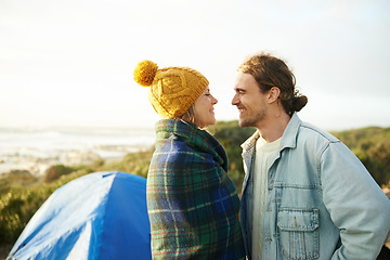 Image showing Happy couple, camping and bonding together in outdoor, blanket and romantic getaway to relax by tent. Man, woman and love on vacation for honeymoon break, adventure and travel for marriage in nature