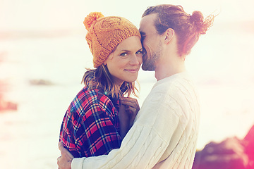 Image showing Beach, smile and portrait of couple hugging with love on vacation, adventure or holiday together. Happy, love and young man and woman embracing with care by ocean or sea on weekend trip in winter.