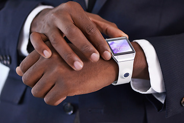 Image showing Businessman, hand and smart watch on wrist with display, online schedule and digital agenda for job. Black person, suit and technology with homescreen on arm for network, application and check time