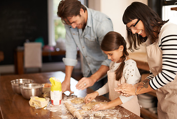 Image showing Mother, father and girl with baking cake in kitchen with oven, happiness and teaching with support. Family, parents and child with helping, learning and bonding with cooking for dinner and cookies