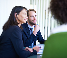 Image showing Business, partnership and employees in meeting, presentation or listening in office, workspace or conference room. Workers, people and team at workshop in corporate career, finance or banking