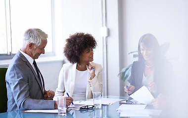 Image showing Business, people and discussion in conference room for strategy or collaboration for planning, partnership and conversation. Boardroom, corporate employees and reports for b2b meeting for company.