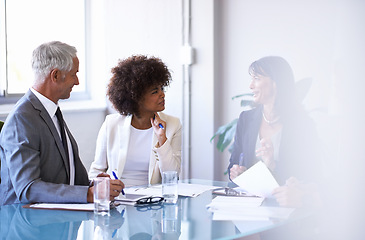 Image showing Corporate, people and discussion in conference room for strategy or collaboration for planning, partnership and conversation. Boardroom, business employees and reports for b2b meeting for company.