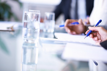 Image showing Business, hands and documents for writing in meeting with brainstorming, planning and water in conference room. Corporate, employees and paperwork by table in boardroom for collaboration and strategy