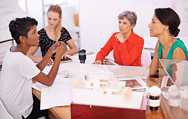 Image showing Group of people, architect or business in meeting, teamwork or planning of creative brainstorm. Businesswomen, blueprint or model as corporate, diversity or collaboration in property development
