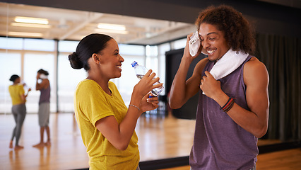 Image showing People, drinking water and break in dance studio, smile and relax from practice or learning routine. Partners, happy and laugh for humor in training, hydration and nutrition for exercise or workout