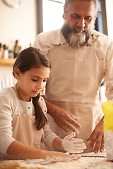 Image showing Girl, child and grandpa with dough in kitchen for cooking, baking and teaching with support and helping. Family, senior man and grandchild with flour for preparation in home with bonding and learning