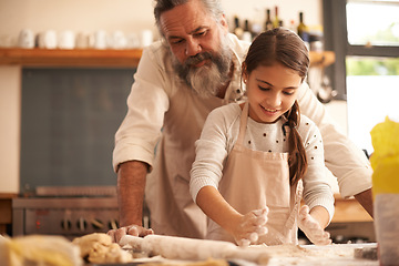 Image showing Girl, child and grandfather with dough in kitchen for cooking, baking and teaching with support or helping. Family, senior man and grandchild with cookies preparation in home for bonding and learning