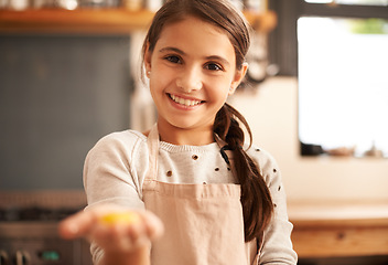 Image showing Girl, portrait and dough in hand for baking, pastry and prepare flour mixture in kitchen. Female person, kid and smile for learning in home, child development and education for cookie skill or cake