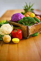 Image showing Table, crate and fresh or organic vegetables for nutrition or wellbeing, ripe and raw ingredients for sustainability or eating. Agriculture, produce and healthy diet for vegan, wellness and protein.