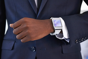 Image showing Businessman, wrist and smart watch on arm for online schedule, digital agenda and high tech for job. Black man, hand and technology with screen for clock access, network and check time at work