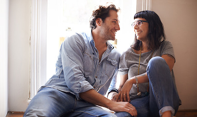 Image showing Floor, laughing or happy couple talking in home living room in conversation or speaking together. Man, funny woman or romantic people in apartment or house with love, support or joke humor to relax