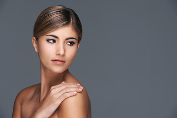 Image showing Skincare, space and thinking with natural woman in studio isolated on grey background for wellness. Aesthetic, beauty and vision with confident young model on mockup for dermatology treatment