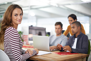 Image showing Portrait, meeting and business woman at table in office in startup company for creative career or job. Face, coworking and professional entrepreneur at desk, worker or designer in workplace with team