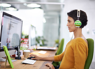 Image showing Woman, headphones and computer for creative business, online and listening to music and check email. Female person, journalist and research on article in coworking space, office and website for radio