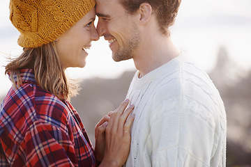 Image showing Happy couple, marriage or bonding together in nature, piggyback or romantic getaway on holiday by blue sky. Man, woman and love on vacation on weekend break, joy and adventure in outdoor on honeymoon