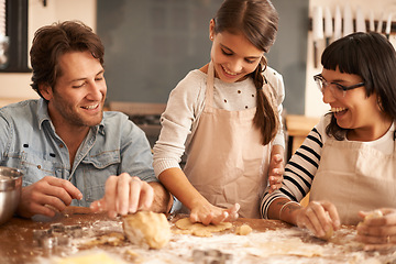 Image showing Mother, father and girl with dough for cooking in kitchen with flour, happiness and teaching with support. Family, parents and child with helping, learning and bonding with baking for snack and hobby