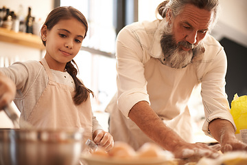 Image showing Girl, child and grandfather with baking in kitchen for cooking, cookies and teaching with support or helping. Family, senior man and grandchild with dough preparation in home for bonding and learning