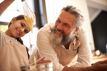 Image showing Girl, child and grandfather with cooking in kitchen for mixing, baking and teaching with support and whisk. Family, senior man and grandchild with dough preparation in home for bonding and learning