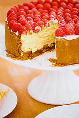 Image showing Dessert, cheesecake and pastry for bakery, raspberries and sweet snack for eating. Fruit, slice and cake stand for display on table in food restaurant, creamy and luxury baked confection with berries