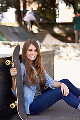 Image showing Fashion, happy and portrait of woman with skateboard in city for exercise, training and skating in park. Skater, fitness and person in trendy, casual and street style for sports, fun hobby and relax