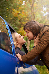 Image showing Transport, travel and couple in car for goodbye, greeting and love for journey, leaving and commute. Road trip, driving and man and woman in vehicle window for bonding, relationship and embrace