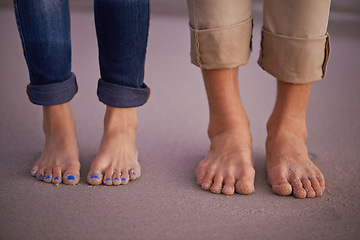 Image showing Beach, man and woman with feet in sand together for romantic date, travel or holiday on island. Ocean, vacation and couple standing on coast for tropical adventure for honeymoon, anniversary and toes