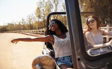 Image showing Women, travel or happy on road trip in countryside, tourist or holiday adventure for leisure in nature. Ladies, driving and smile in convertible suv in summer and bonding together for tour in texas