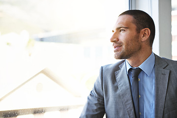 Image showing Thinking, window and businessman in office with smile, opportunity or brainstorming at startup. Solution, reflection and man at glass with business plan idea, inspiration and vision for entrepreneur