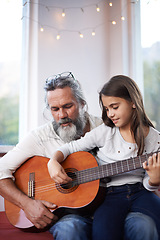 Image showing Old man, girl or guitar as teaching, music or training as creative practice for skill development. Grandpa, kid or instrument as learning to mentor, guide or advice as song, bonding or together