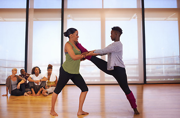 Image showing Stretching, women and dance in studio with partner, personal trainer and happy African friends together for fitness. Rhythm, moving and people in gym for practice, performance and flexibility of legs