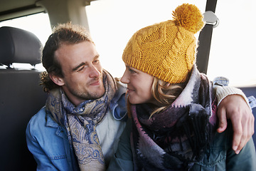 Image showing Couple, hug and happy together in car, travel and bonding with road trip for date or anniversary. Love, trust and commitment with partner, loyalty and cuddle for warmth in winter, vacation and smile