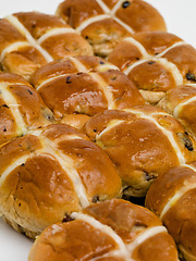 Image showing Hot cross, buns and easter for traditional holiday food for vacation brunch as celebration baked goods, treat or religion. Snack, meal and festive season fiber or nutrition dessert, recipe or event