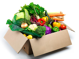 Image showing Studio, groceries and vegetables in box with organic food, ingredients and produce on white background. Nutrition, harvest and container with products for vegan lifestyle, sustainability and wellness