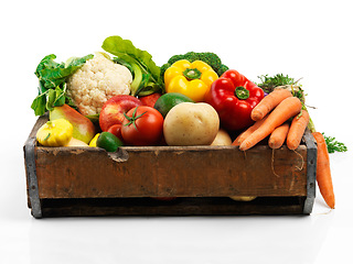 Image showing Studio, crate and fresh or organic vegetables for nutrition or wellbeing, ripe and raw ingredients for sustainability or eating. Agriculture, produce and healthy diet for vegan, wellness and protein.