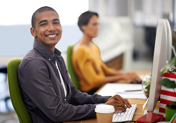 Image showing Portrait, smile and computer for happy employee, office and typing at desk in workspace. Technology, keyboard and businessman or journalist person, writing and working for company project online
