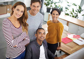 Image showing Startup, creative and portrait of employees at desk, teamwork and digital branding or design on laptop or computer. Happy, people and casual for designer company or agency, collaboration and top view