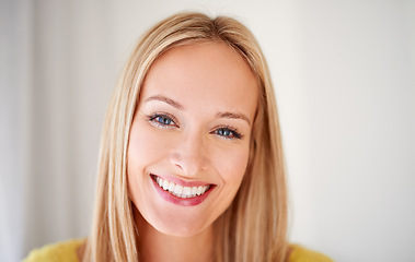 Image showing Happy, portrait and woman in a house with positive attitude, confidence and feel good mood on wall background. Face, smile and female person cheerful on vacation, holiday or day off in a living room