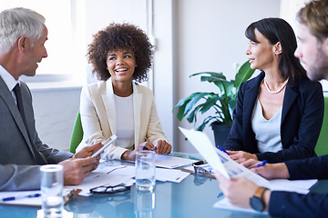 Image showing Business people, teamwork and meeting with documents in office for financial planning, brainstorming and diversity. Professional, employees and collaboration in boardroom with strategy and happiness