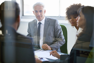 Image showing Business people, collaboration and meeting with documents in office for corporate planning, networking and diversity. Professional, employees and teamwork in boardroom with lens flare and cooperation