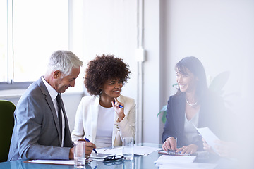 Image showing Corporate, employees and discussion in conference room for strategy or collaboration for planning, partnership and conversation. Boardroom, business people and reports for b2b meeting for company.