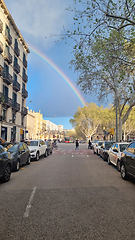 Image showing BARCELONA, SPAIN - APRILL 1, 2024: Rainbow over city street