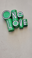 Image showing Green one love sign on building