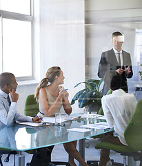 Image showing Meeting, presentation and businessman in office with reflection, stats or speaker at b2b workshop. Teamwork, discussion and business people in conference room brainstorming ideas, planning and review